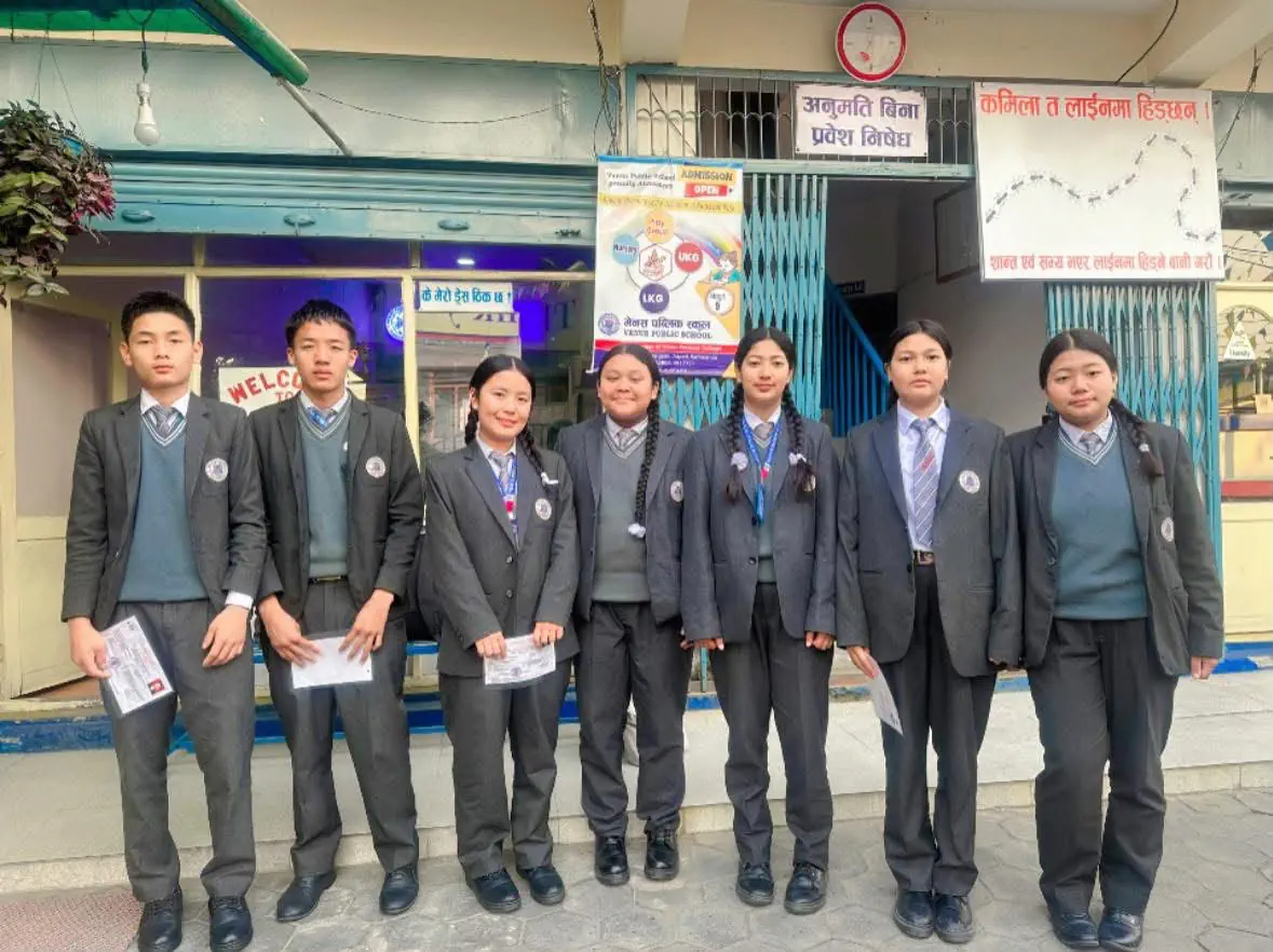 Venus Public School students standing outside the school entrance