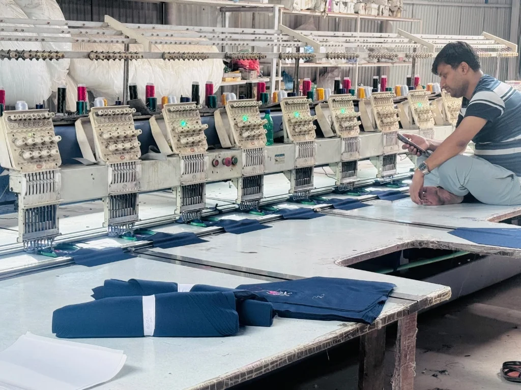 Multi-head computerized embroidery machines stitching school crests